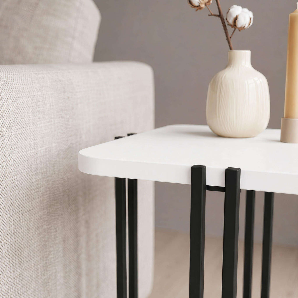 Two-tier side table with white top, black frame, and lower shelf.