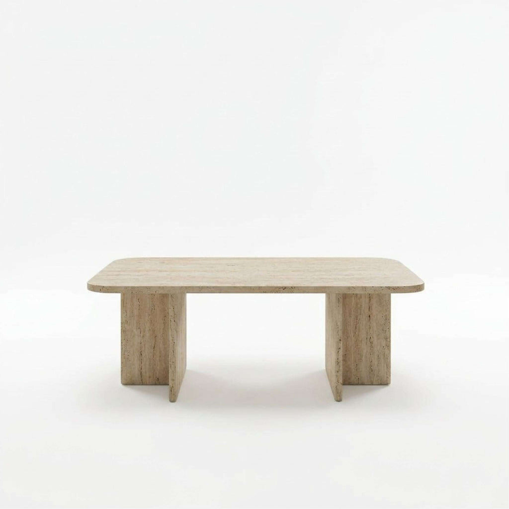 Light stone-look rectangular coffee table with rounded corners and tapered legs