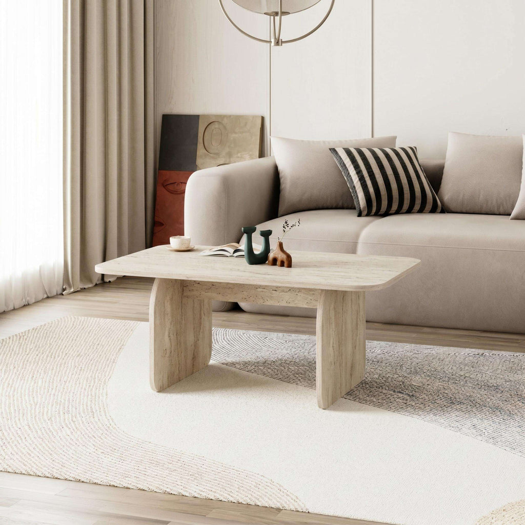 Light oak coffee table with rounded rectangular top and thicker block-style legs