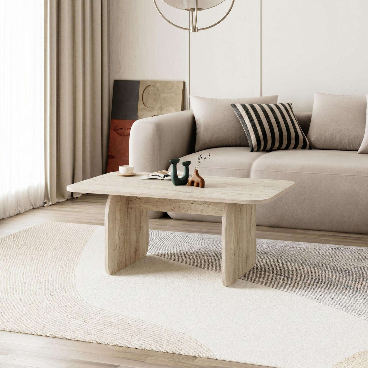 Light oak coffee table with rounded rectangular top and thicker block-style legs