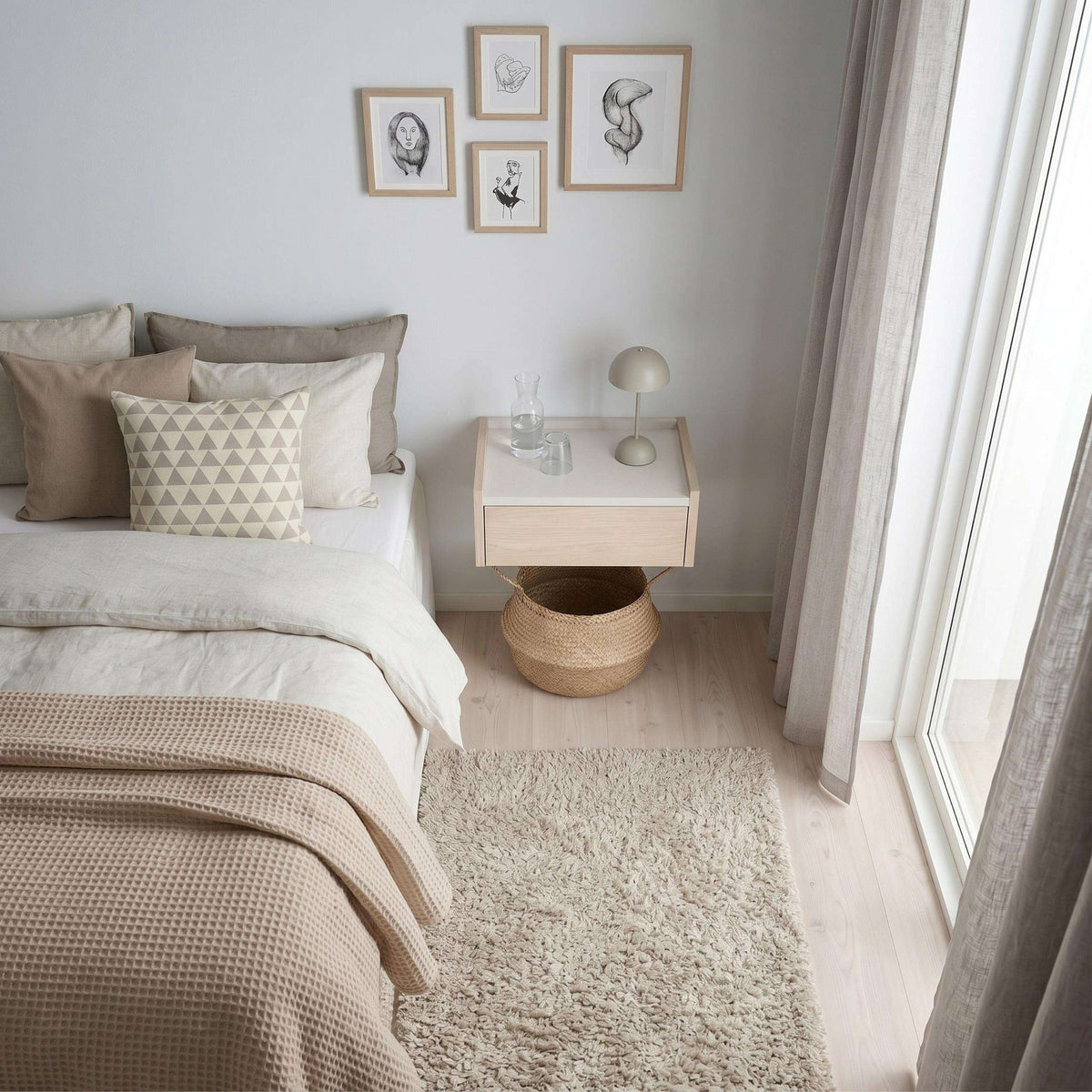 Floating bedside table with drawer and top shelf, light wood with open shelf