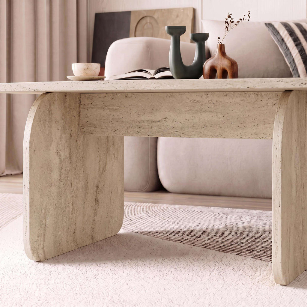 Travertine coffee table with open apron and rounded corner edges