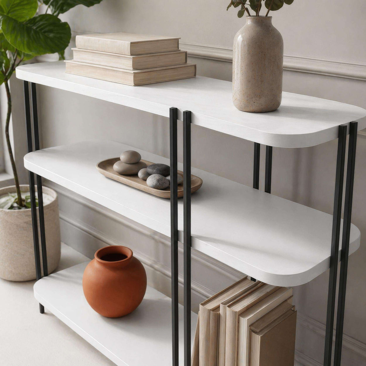 White console table with three shelves and black metal frame
