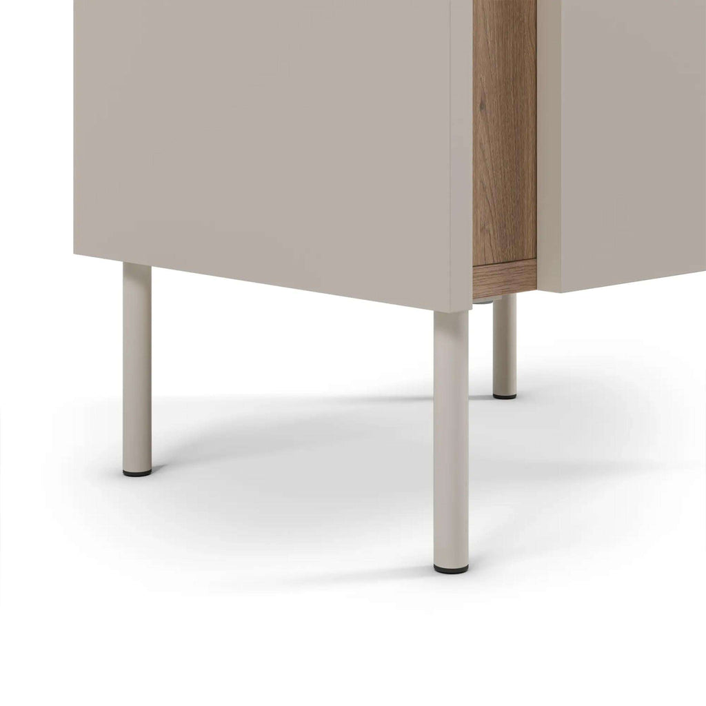 Bedside table base with light metal legs and wood corner detail under cabinet