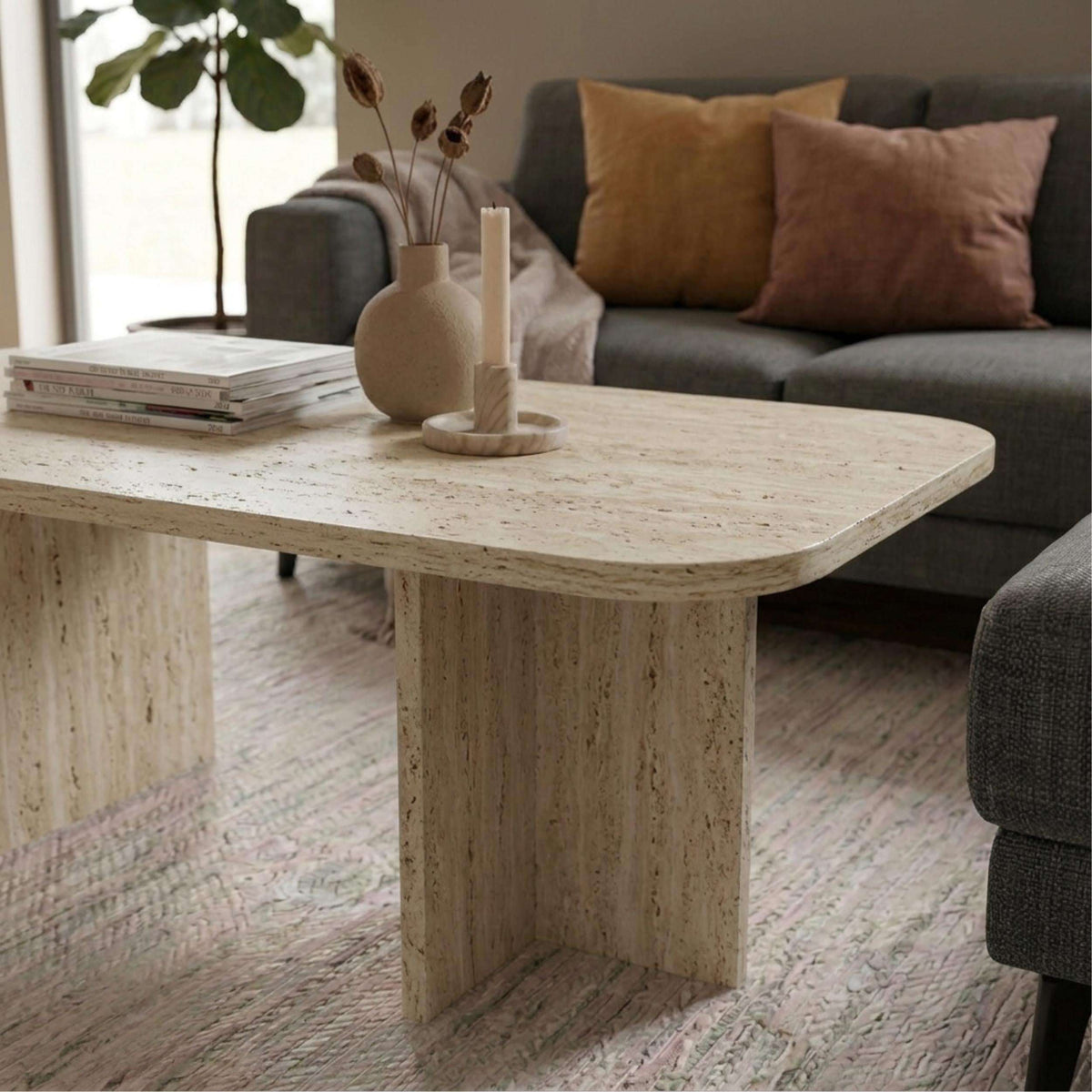 Rectangular travertine-look coffee table with textured surface and tapered legs