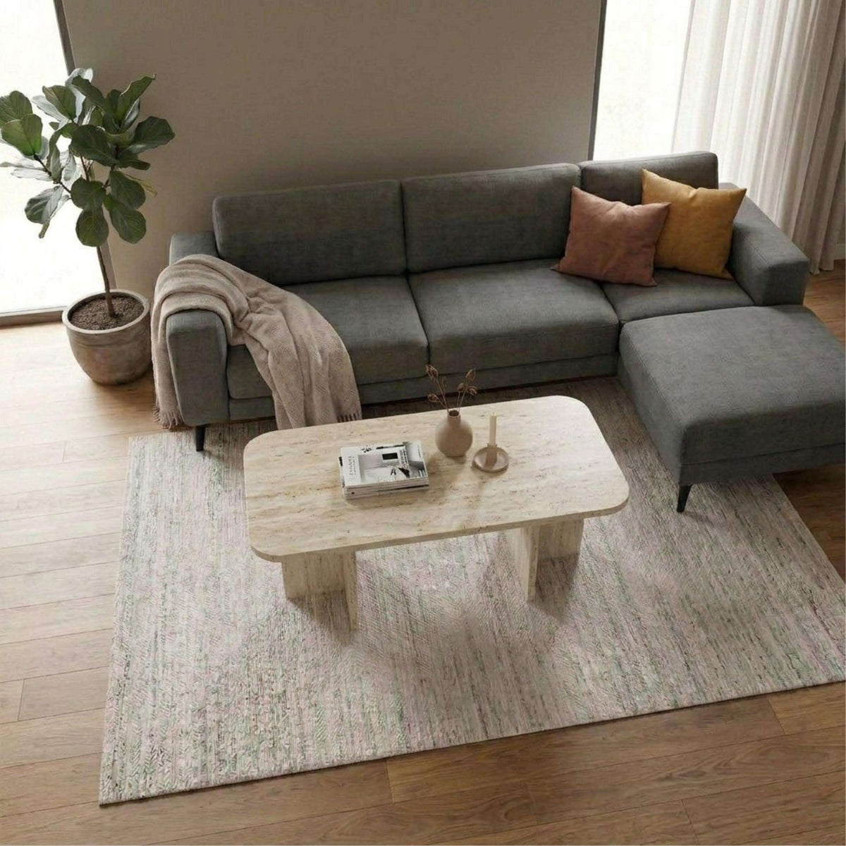 Rectangular coffee table with light stone-look top and rounded edges, tapered legs