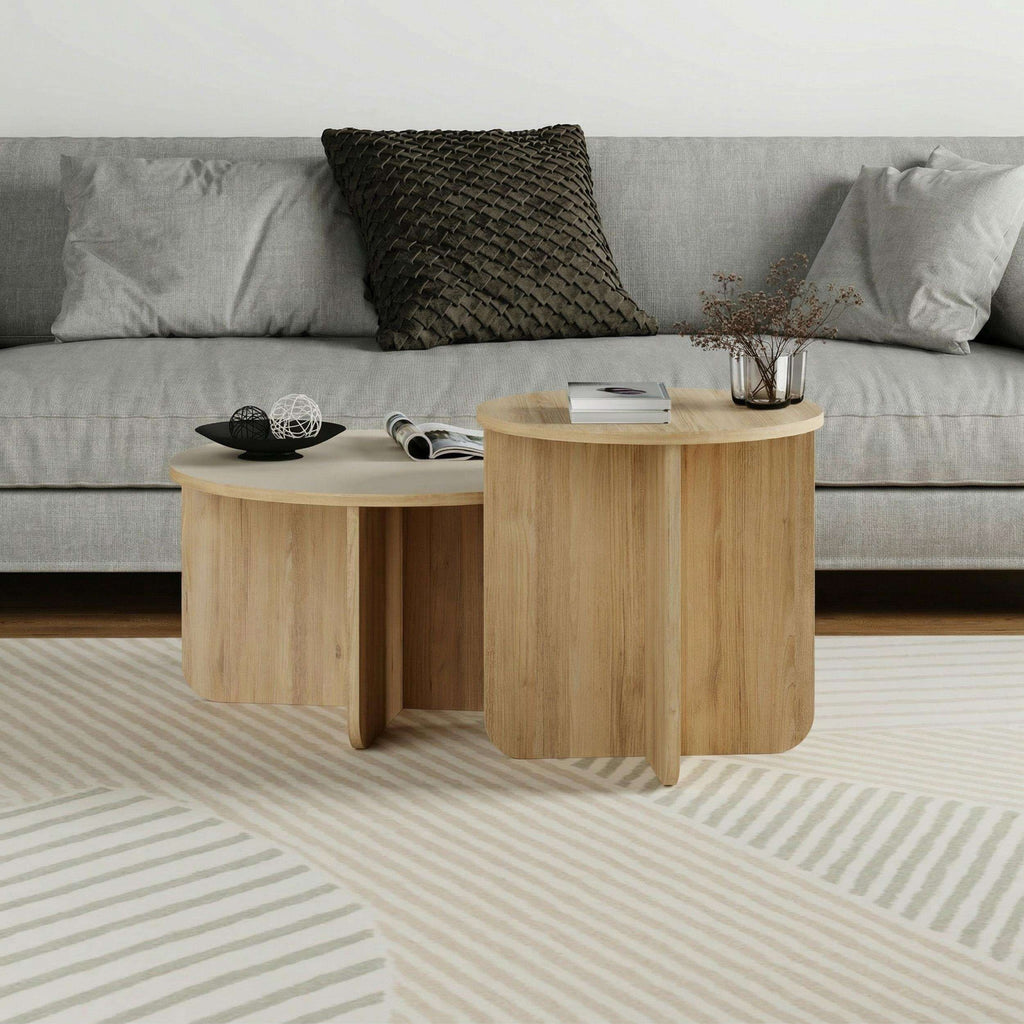 Light oak nesting coffee tables with curved aprons and rounded corners