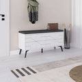 White shoe storage bench with dark seat top and geometric drawer fronts, angled legs