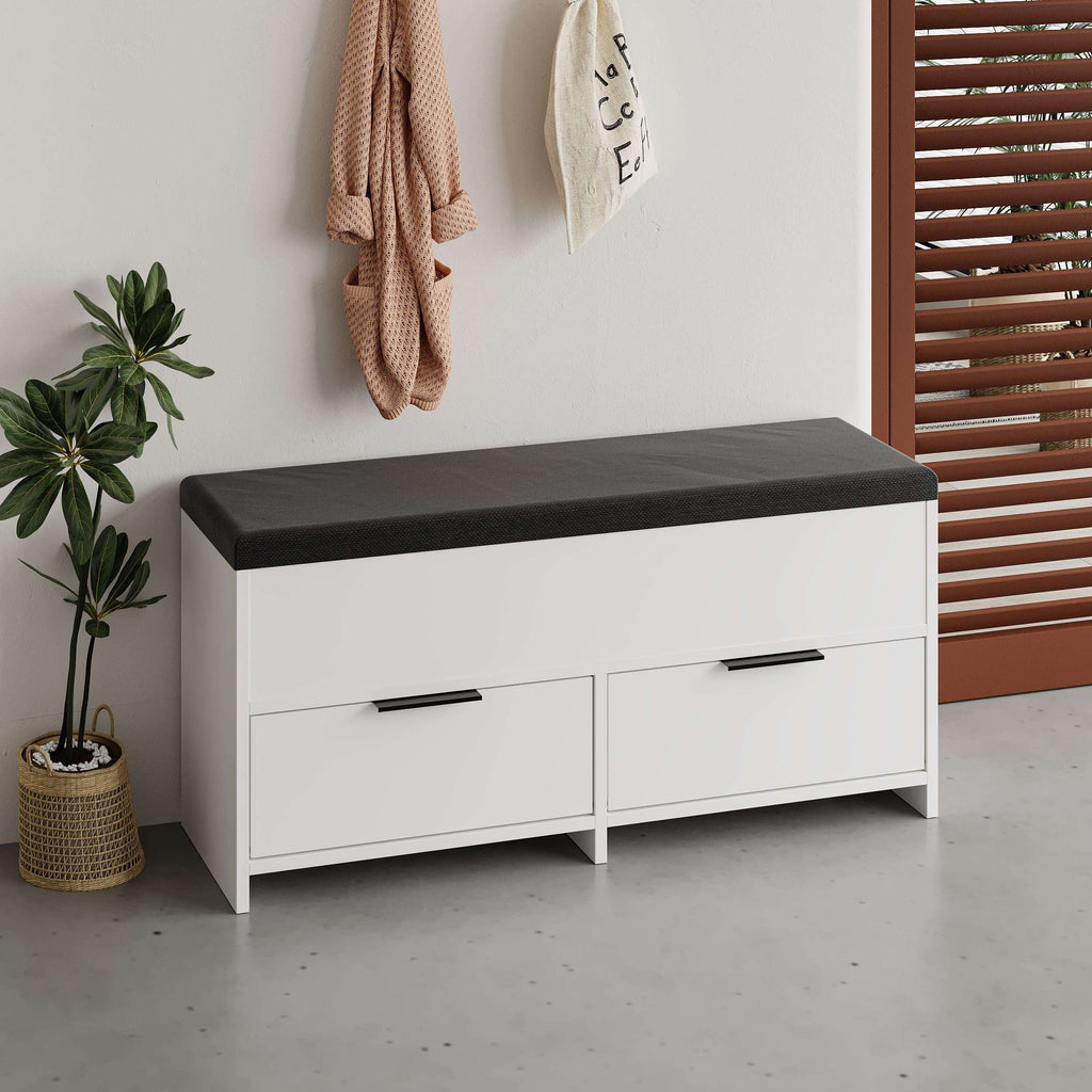 White shoe storage bench with black cushioned top and two front drawers