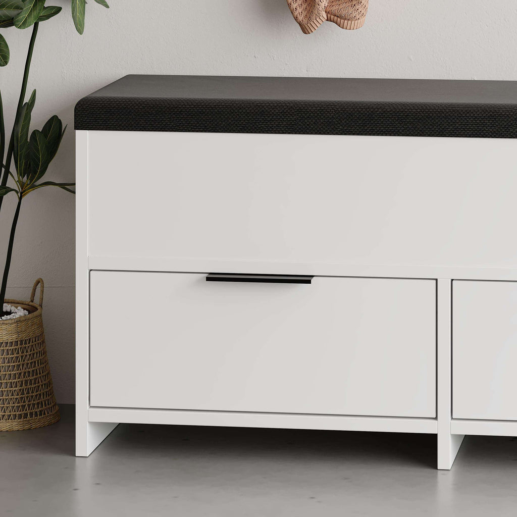 White shoe storage bench close-up with dark cushioned top and two drawers