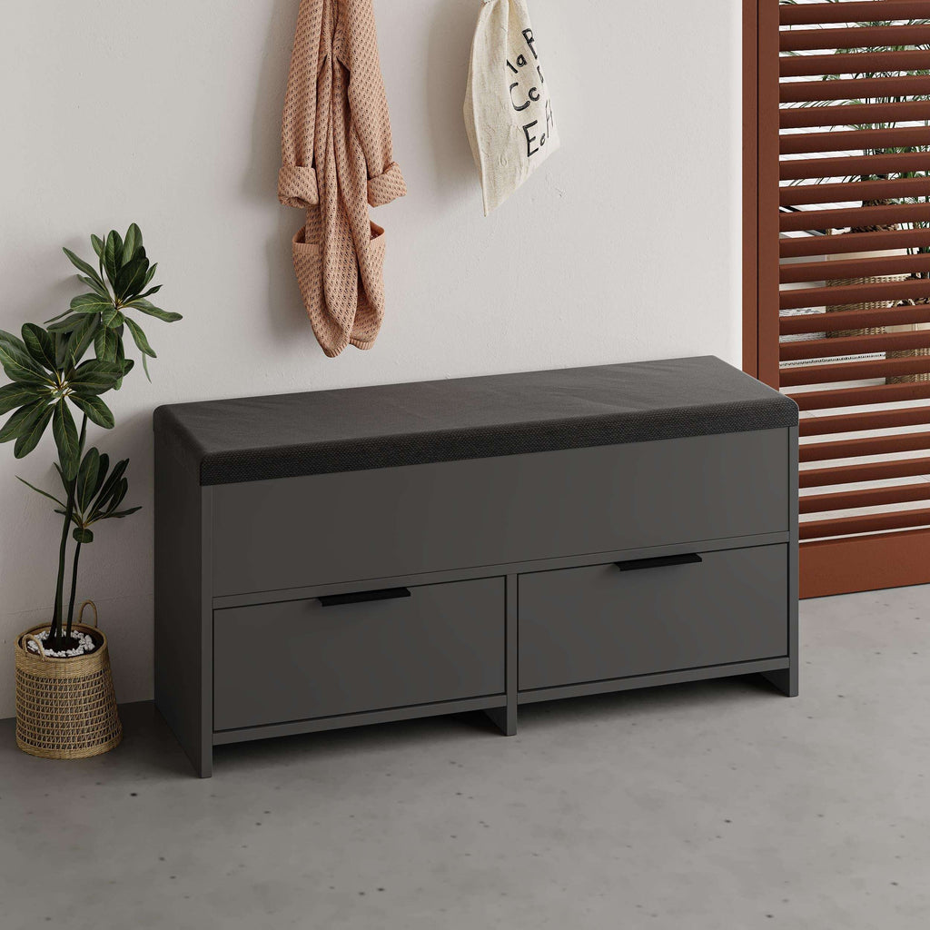 Dark gray shoe storage bench with black cushioned top and two front drawers