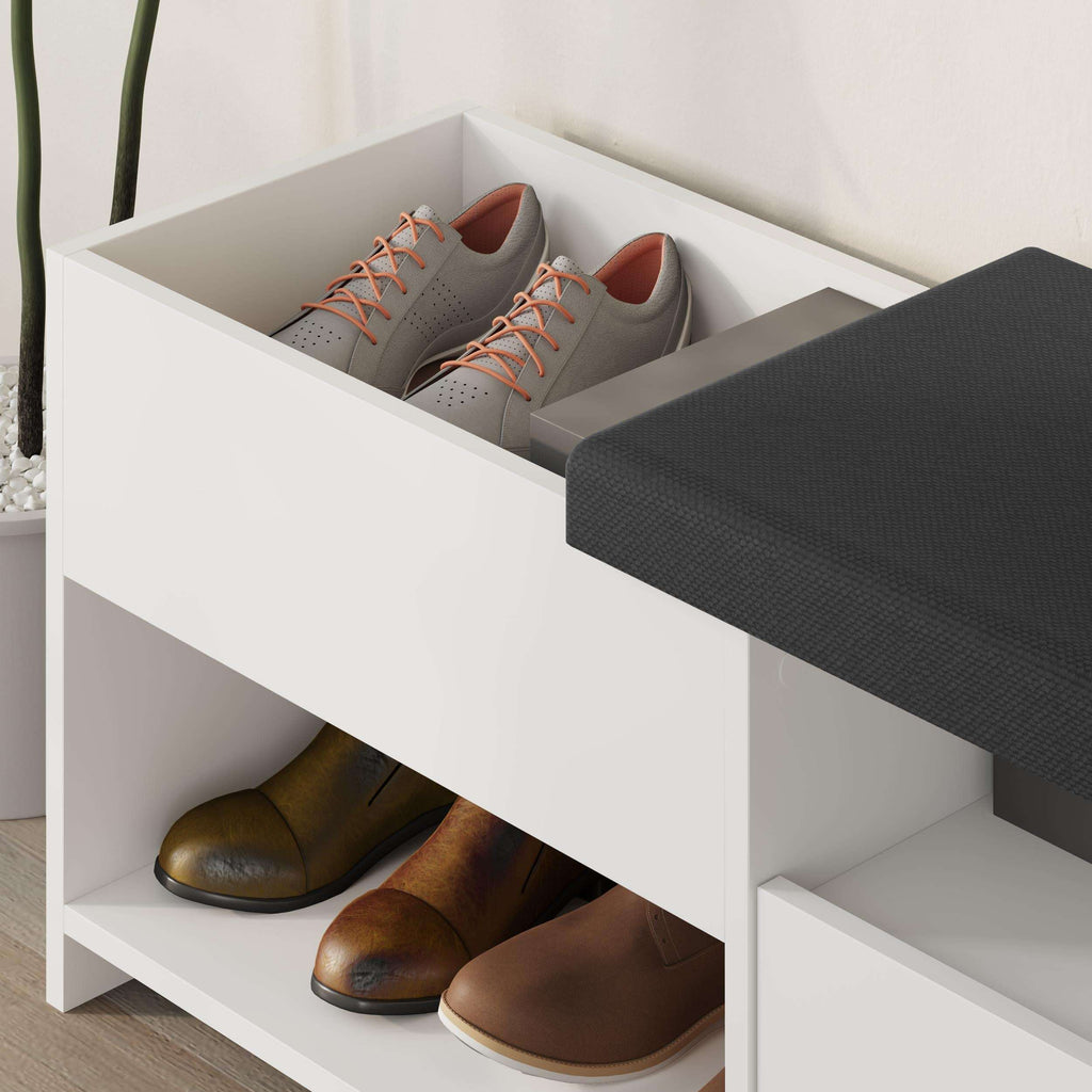 White shoe bench with black cushioned seat and open drawer compartments with shoes