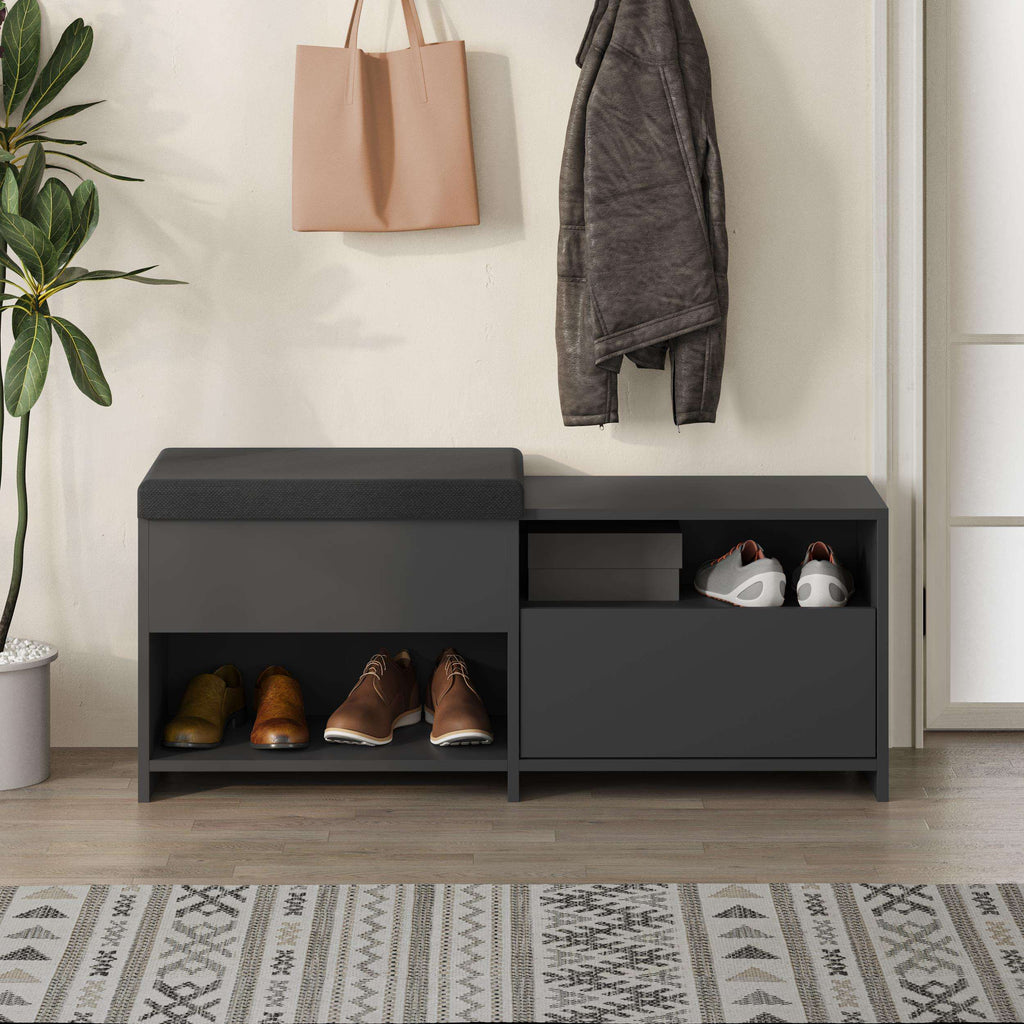 Dark gray hallway shoe bench with padded top, open shelves, and a storage drawer.