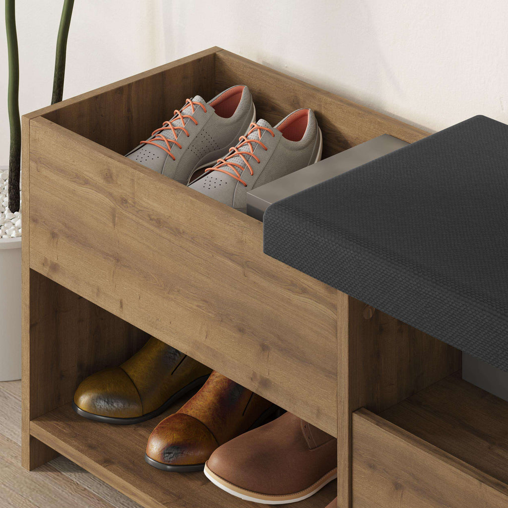 Shoe bench with open storage compartments and cushioned dark top, holding shoes.