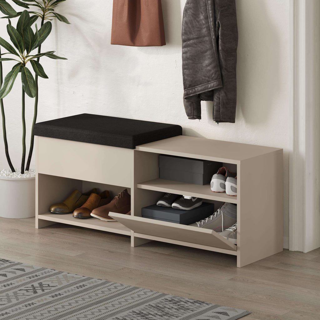 Shoe bench with black cushion, beige frame, open cubbies with shoes and storage tray
