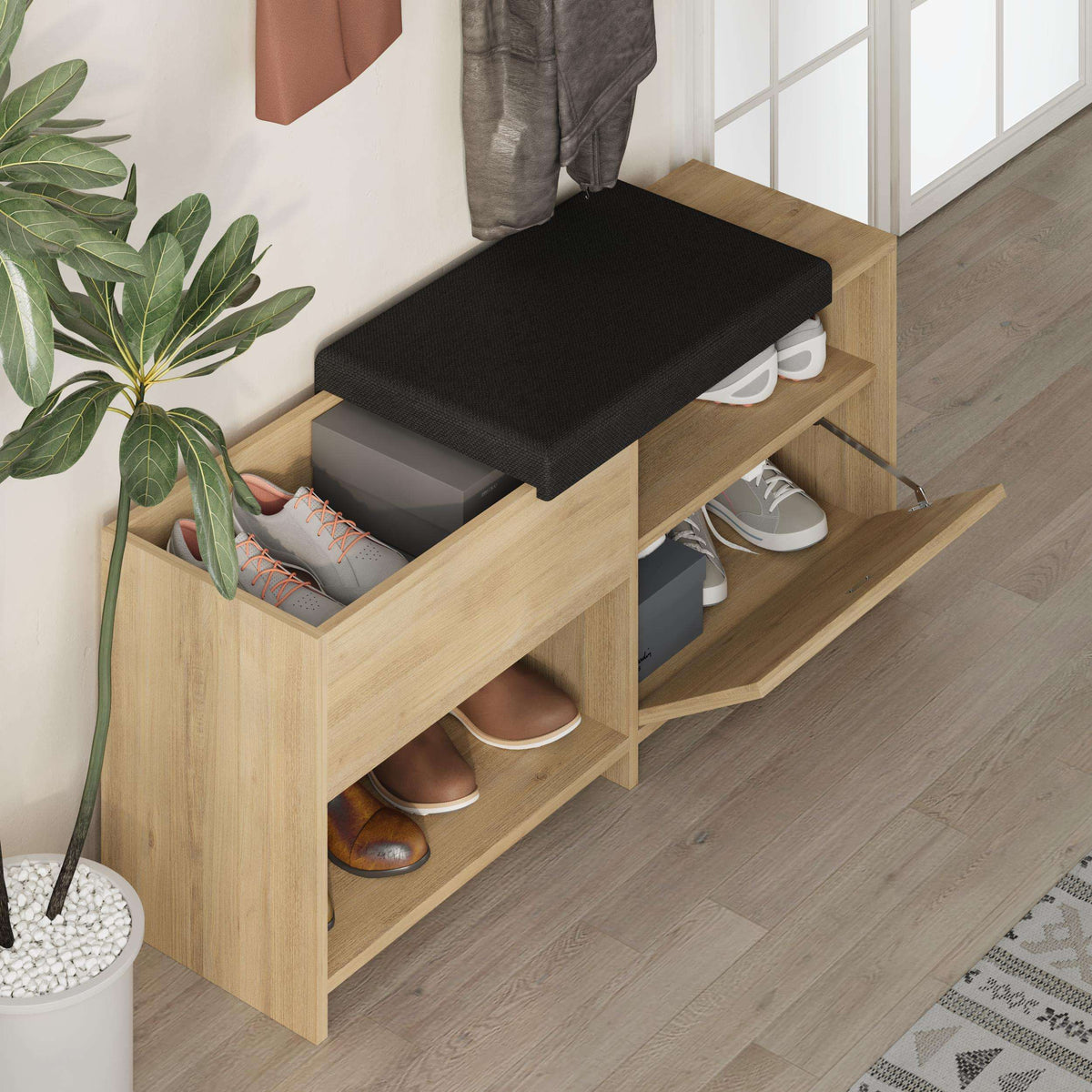 Light oak shoe bench with black seat cushion and open shoe storage drawers