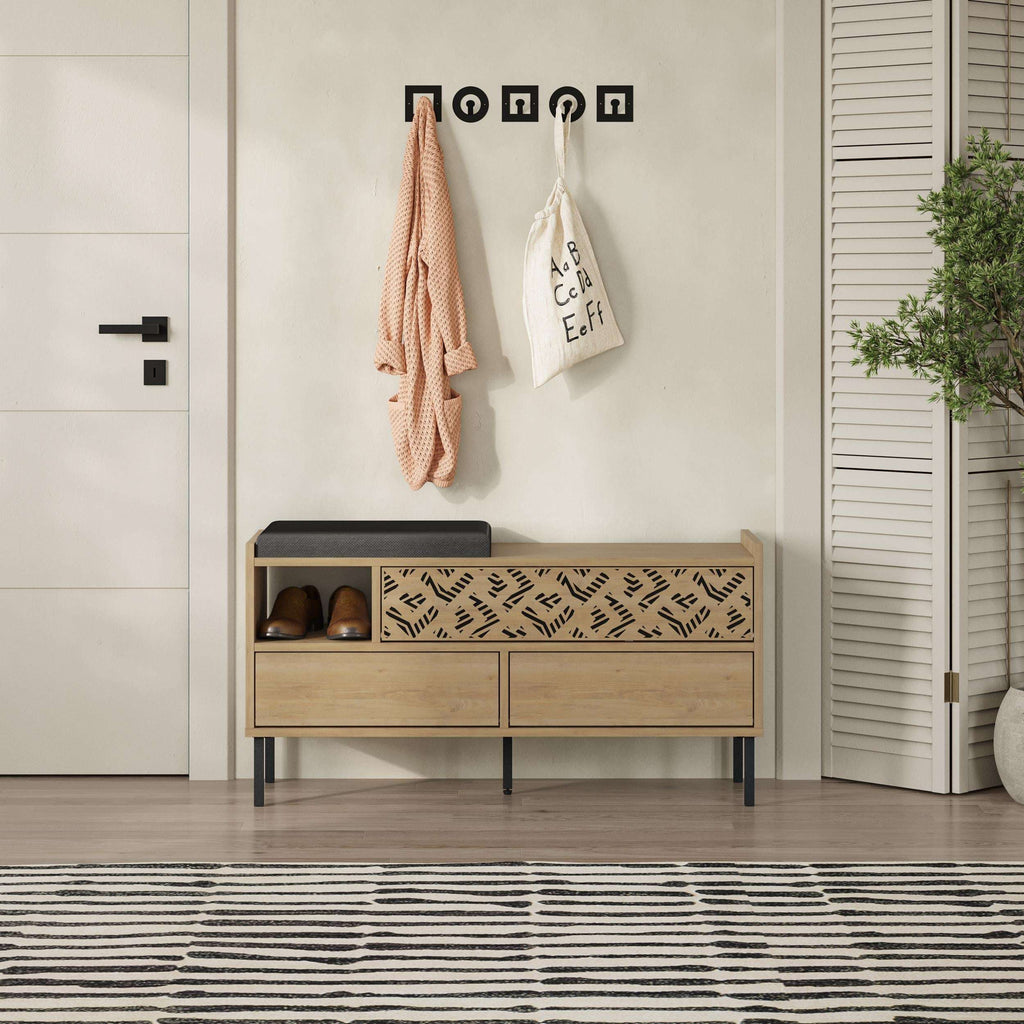 Shoe storage bench with dark top seat and open compartments, patterned drawer front