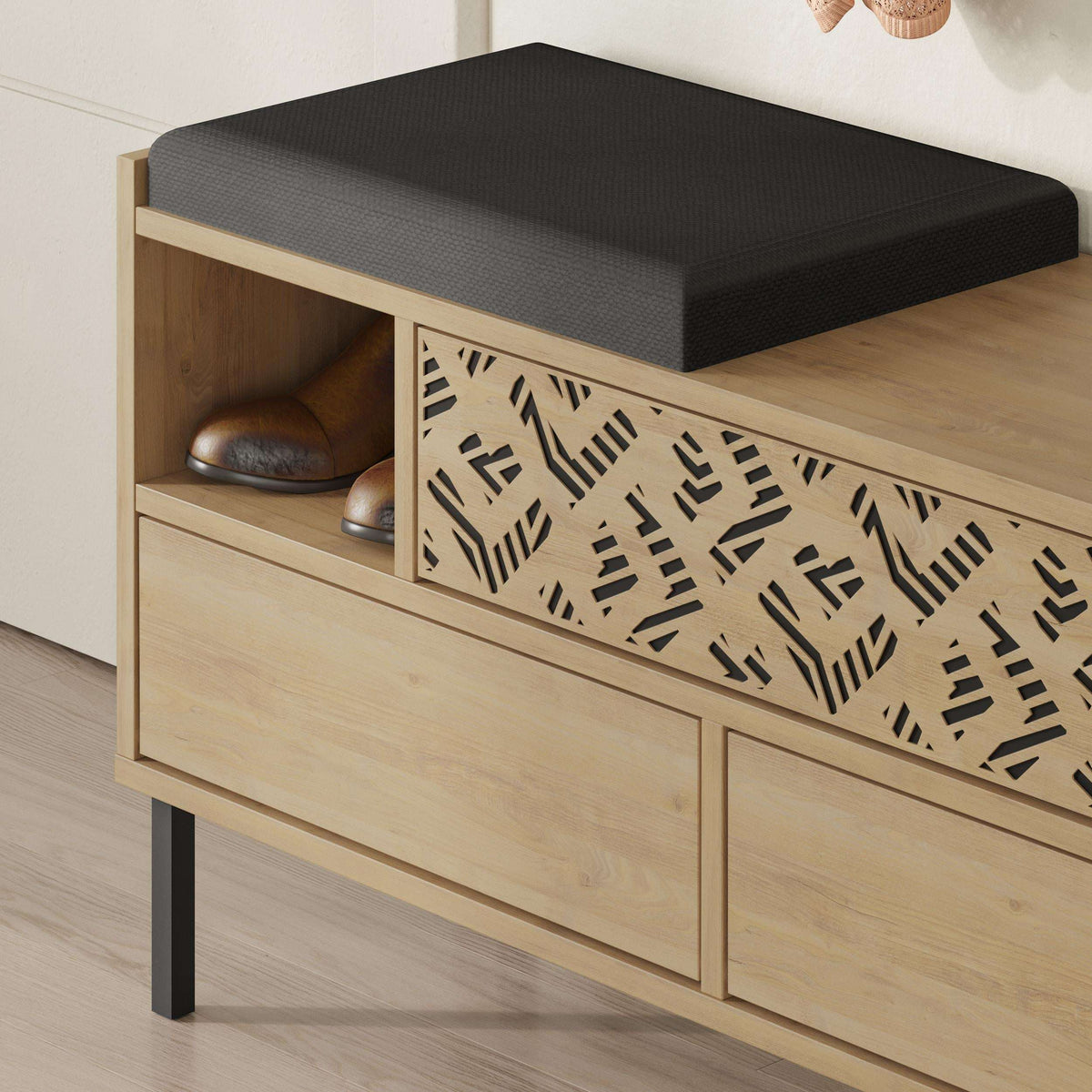 Wood shoe storage bench with black seat cushion and decorative front grille
