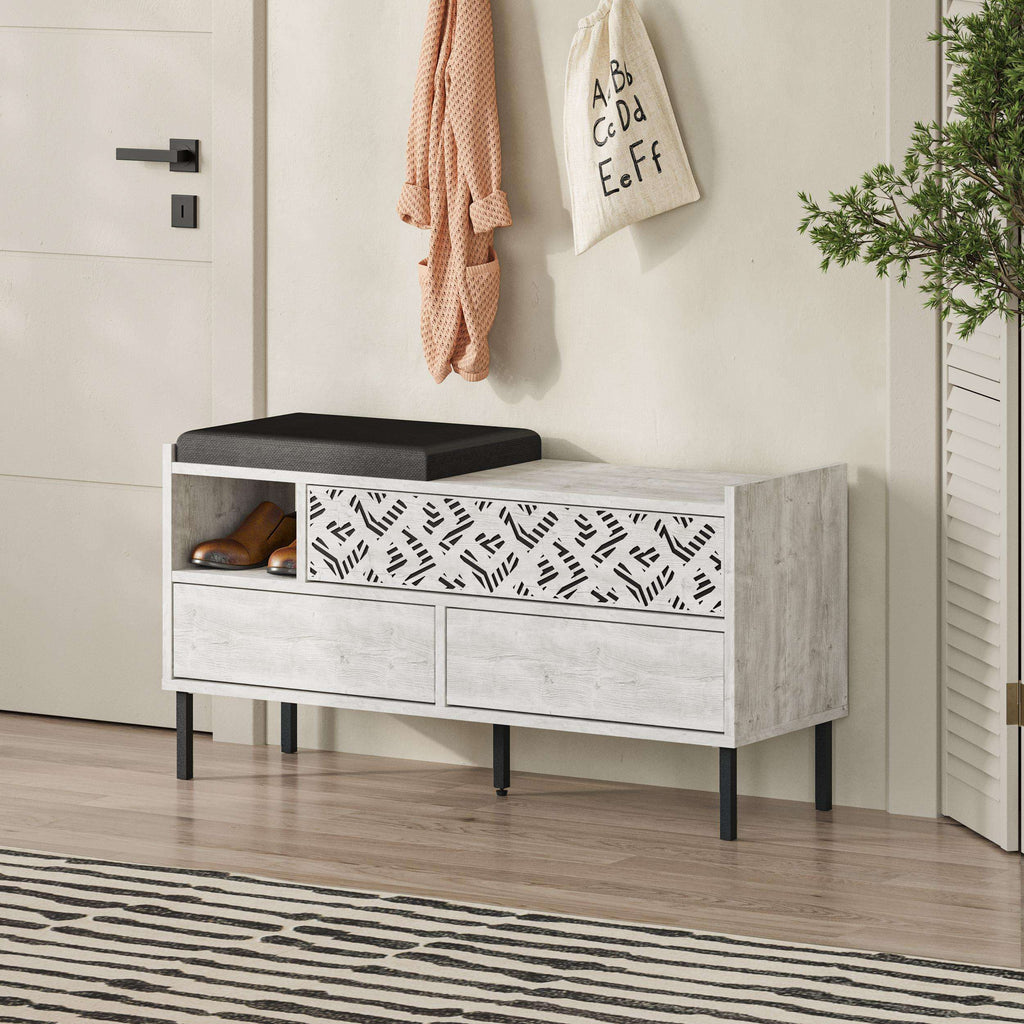 Shoe storage bench with black seat and patterned front panel, open shoe compartments
