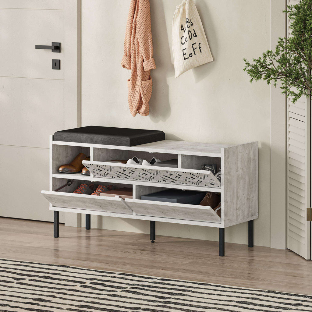 Shoe storage bench with black seat, open shoe compartments, and three-door front
