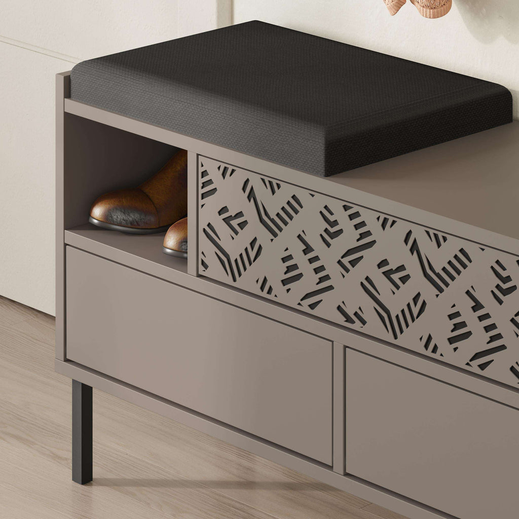 Shoe storage bench close-up with black seat and open shoe shelf behind patterned panel