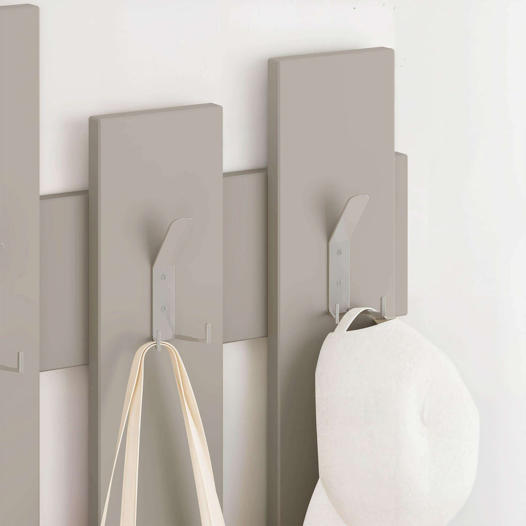 Dark wood coat rack with staggered vertical panels and small coat hooks
