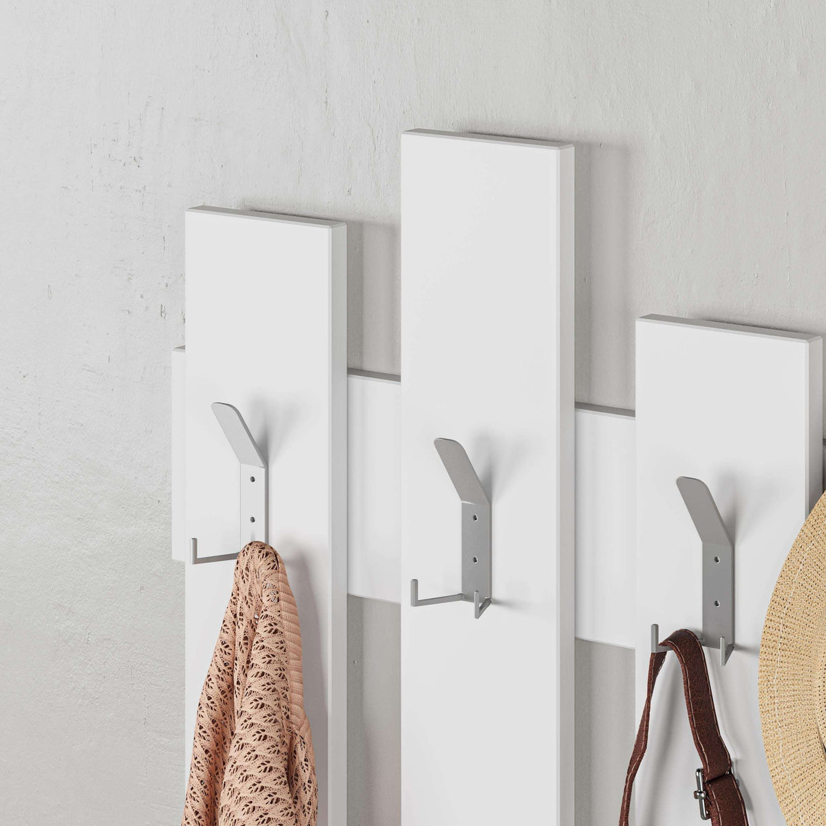 White wall coat rack with wave-style hangers and curved metal hooks