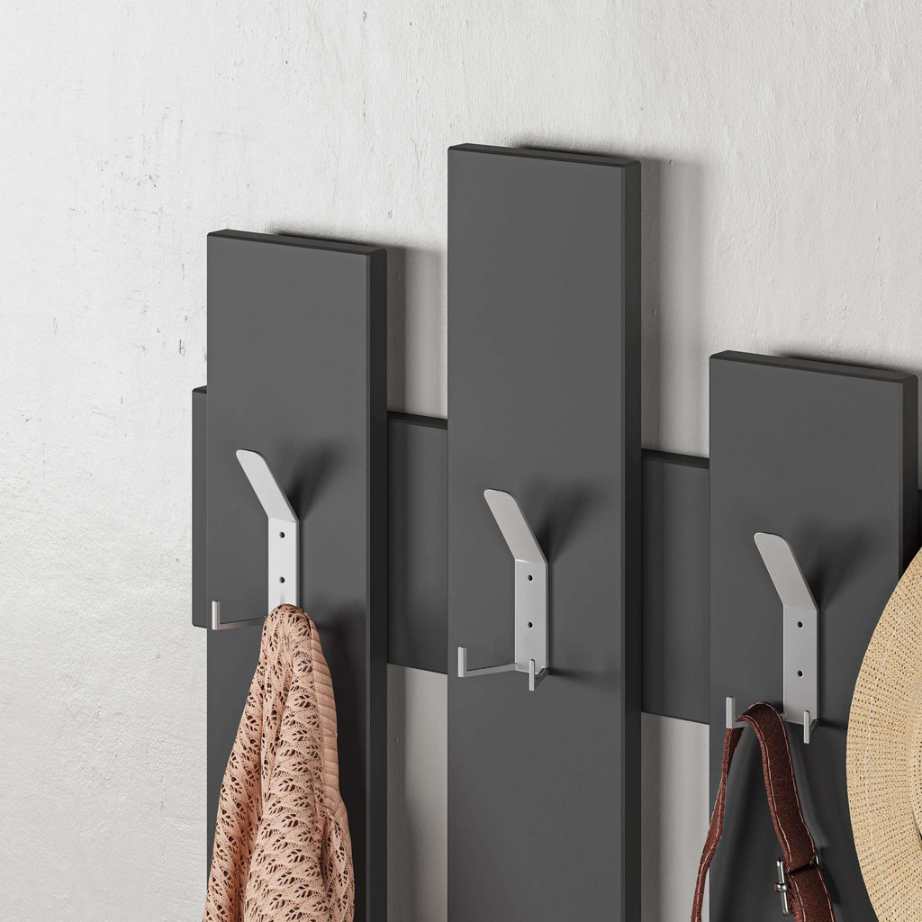 Anthracite wall coat rack with light hooks, shown with coats and bags