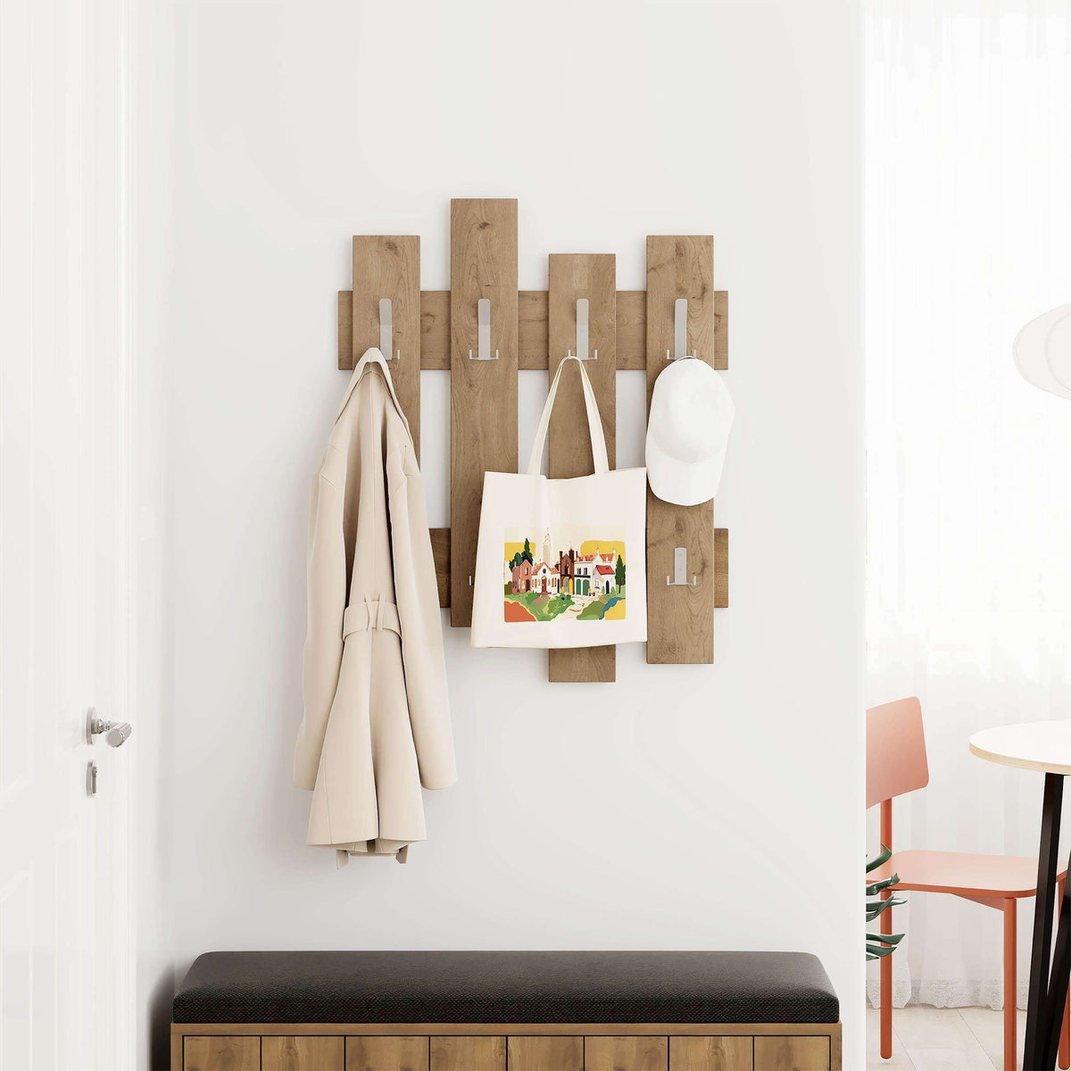 Wall-mounted wave coat rack in light wood with multiple hooks for coats and bags