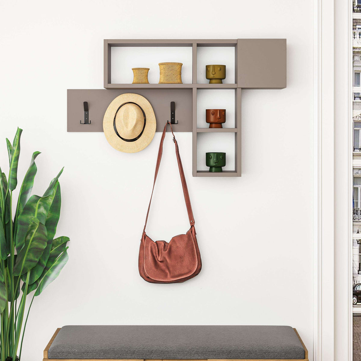 Wall-mounted game hanger with open shelves and three black coat hooks; includes hat and bag.
