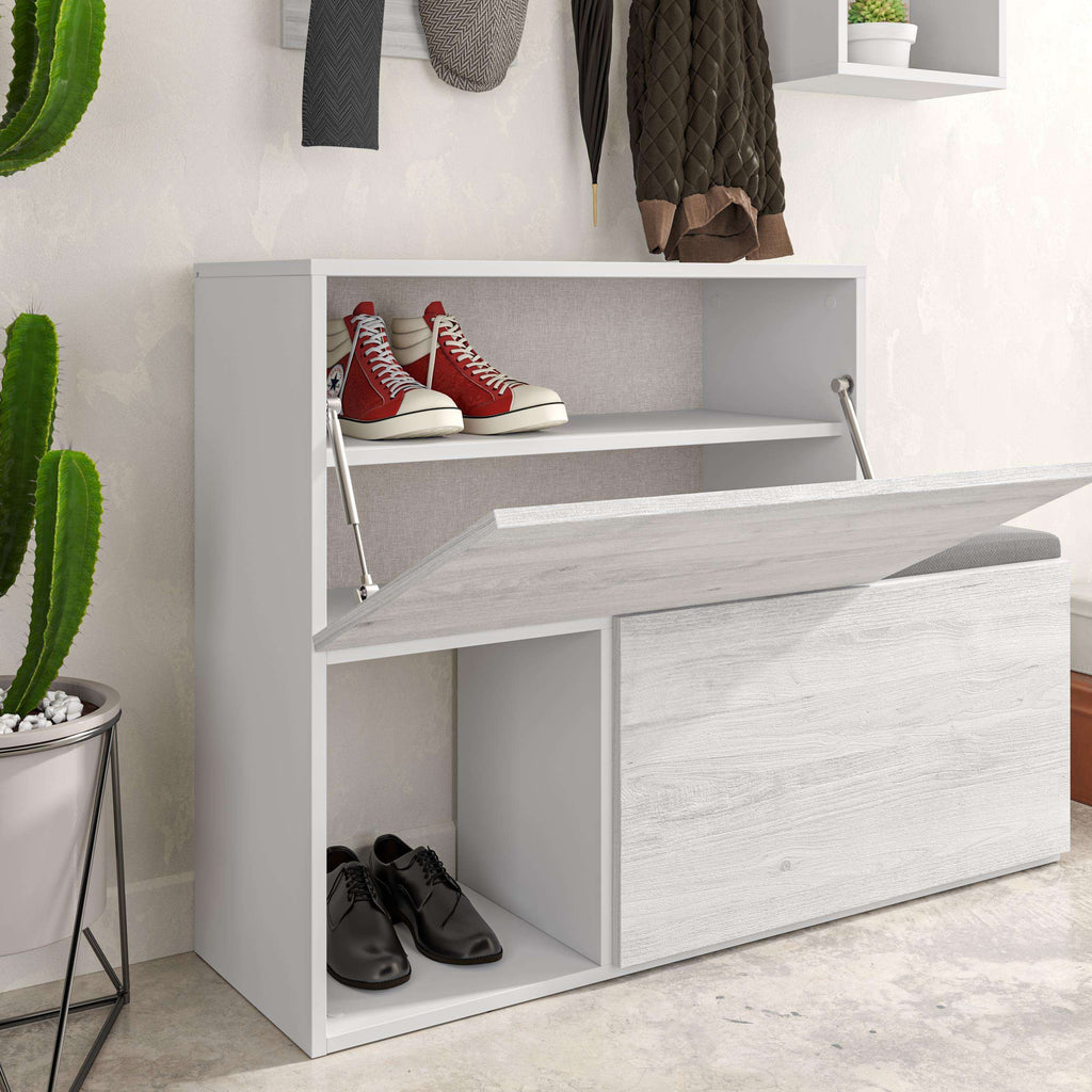 White shoe cabinet close-up with open shoe cubbies and flip-down bench seat