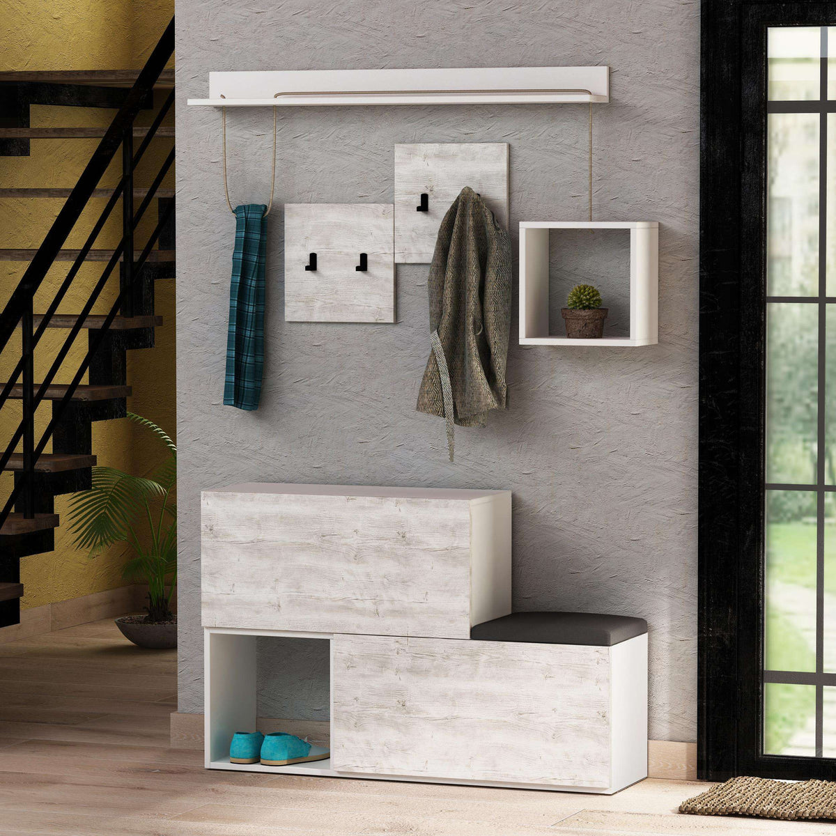 White shoe cabinet with shelves and wall hooks, showing hanging coats and cubby storage