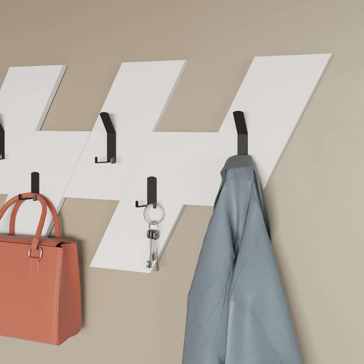Wall-mounted coat hanger with light wood slats, black hooks, and metal key rings