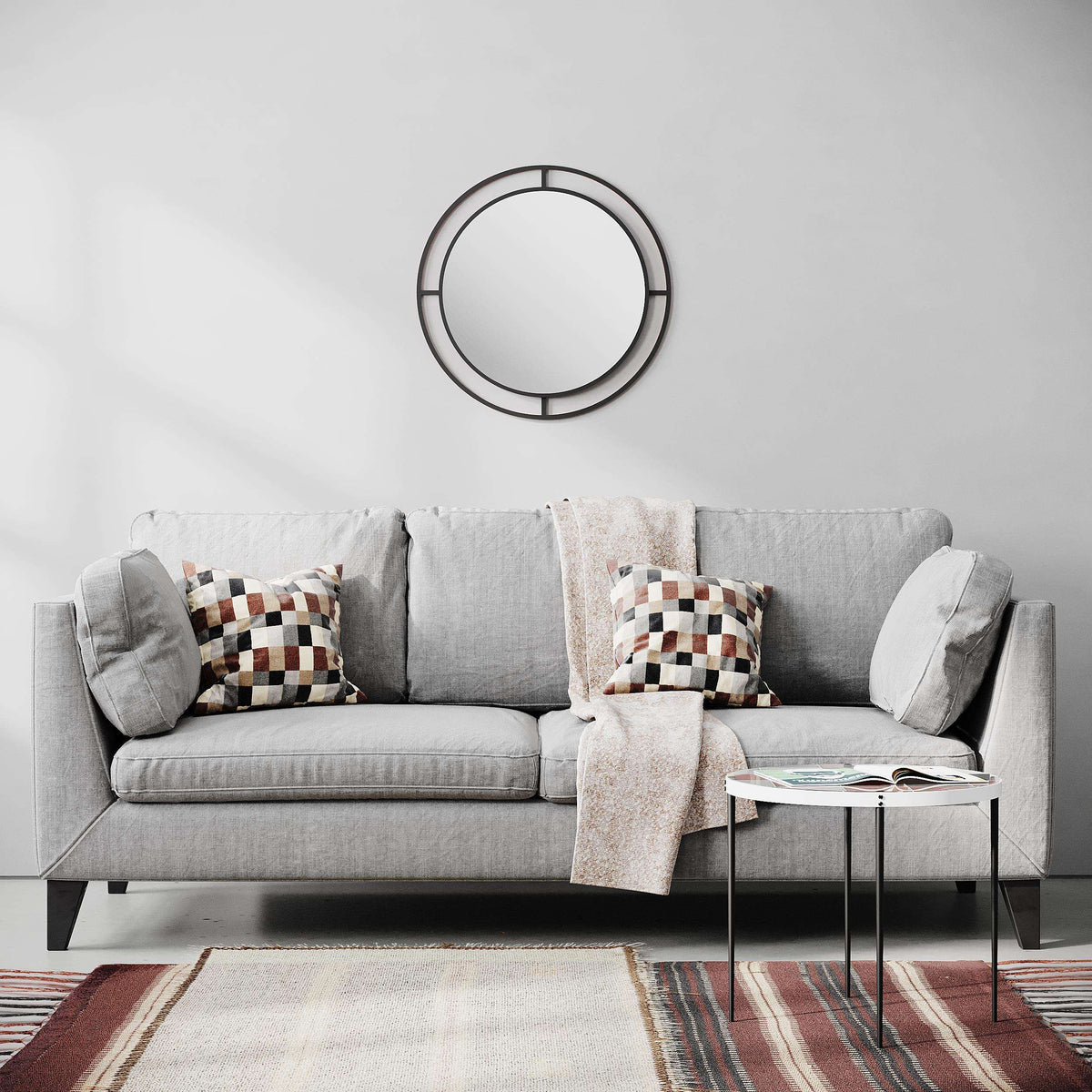 Wall mirror with dark round frame and segmented bars, clear reflective glass center.
