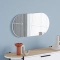 White rounded wall mirror with slim frame, oval shape for mounting on wall.