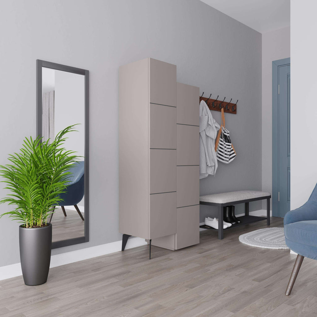 Light beige storage cabinet with angled feet and stacked compartments next to entry wall