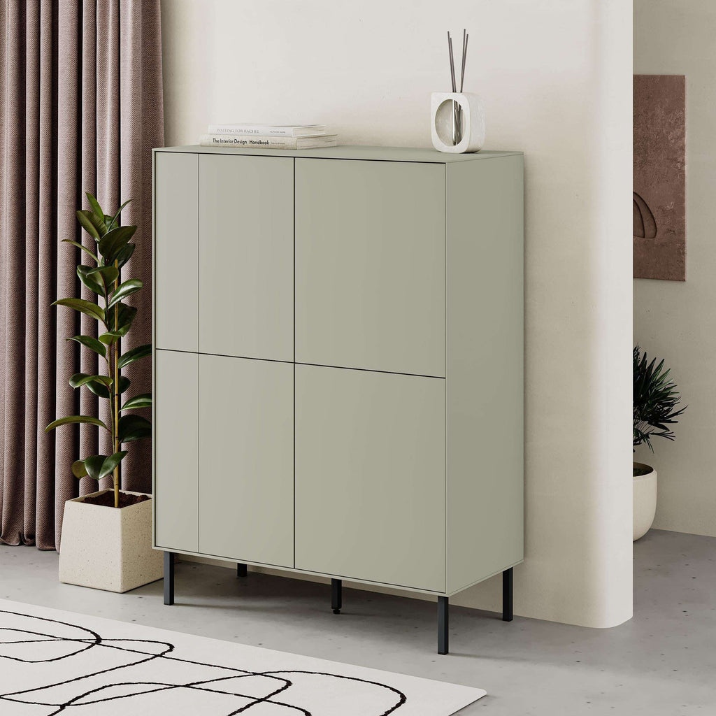 Multipurpose cabinet with closed doors; sage green panels and dark metal legs.