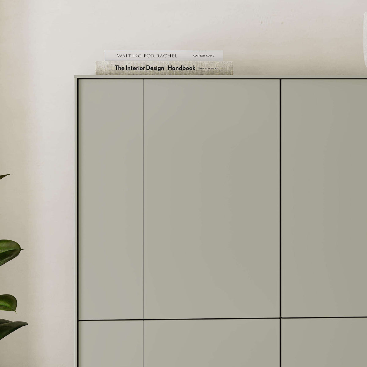 Cabinet front close-up with three door sections; smooth pale green panels.