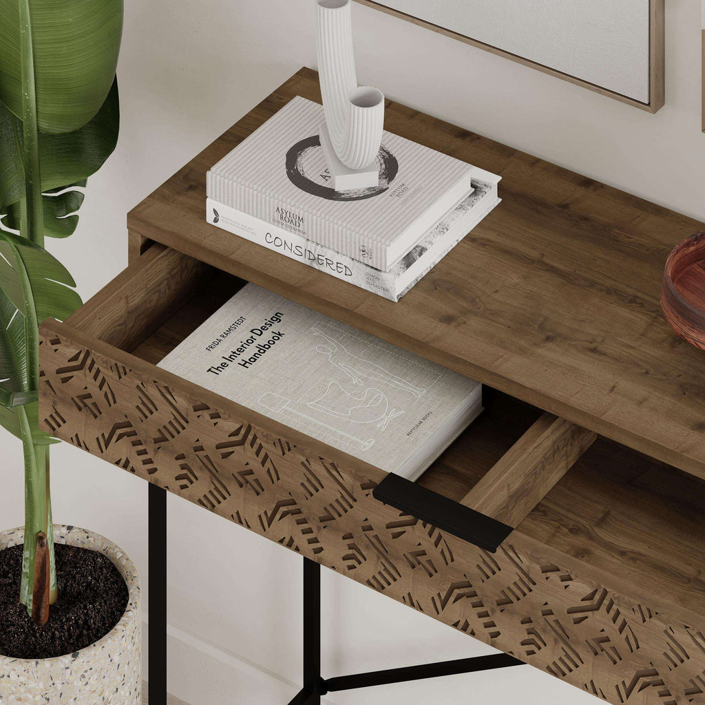 Wood console display unit with patterned drawer front, open shelf, and black X-frame legs