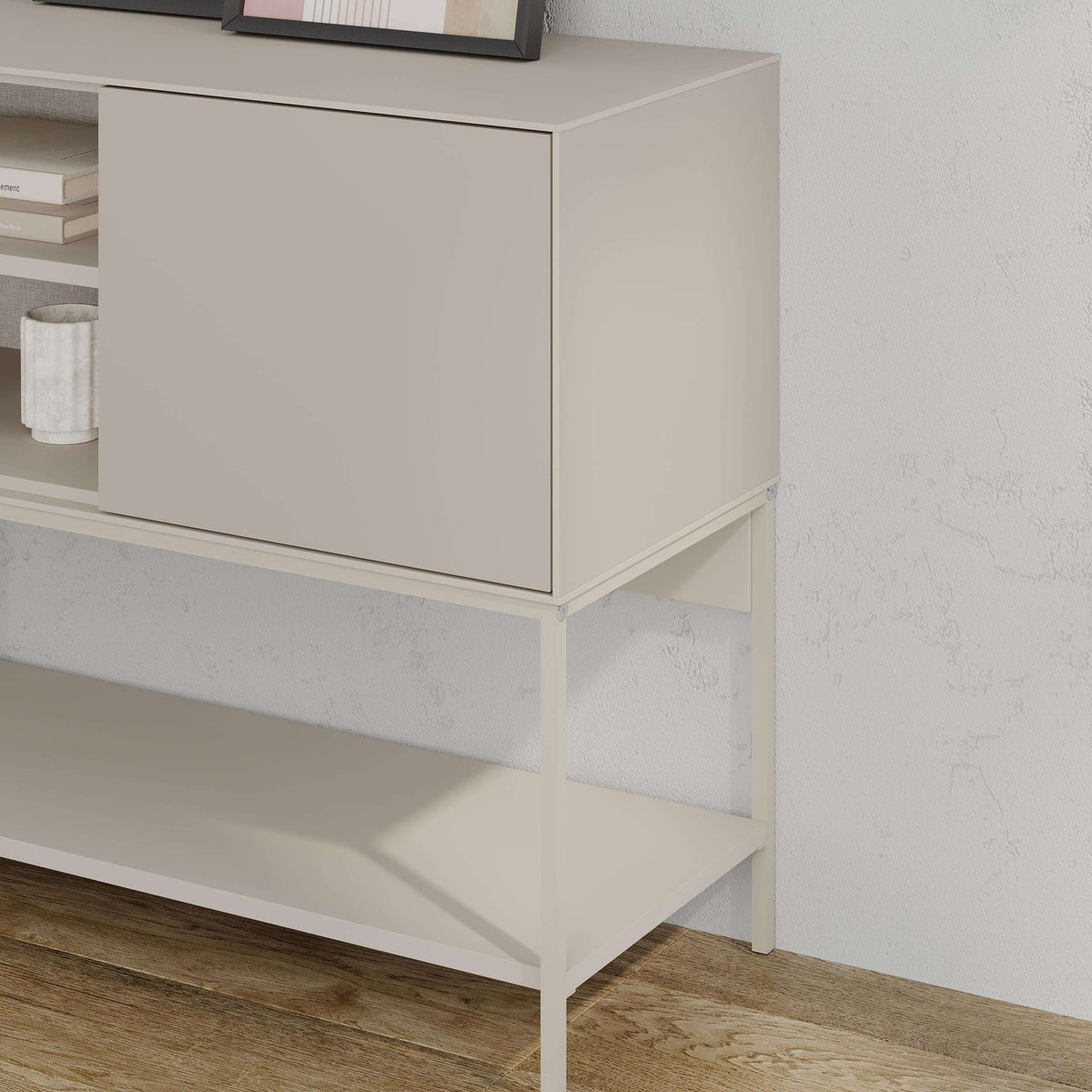Close-up of light stone cabinet door and open shelf on modern console table