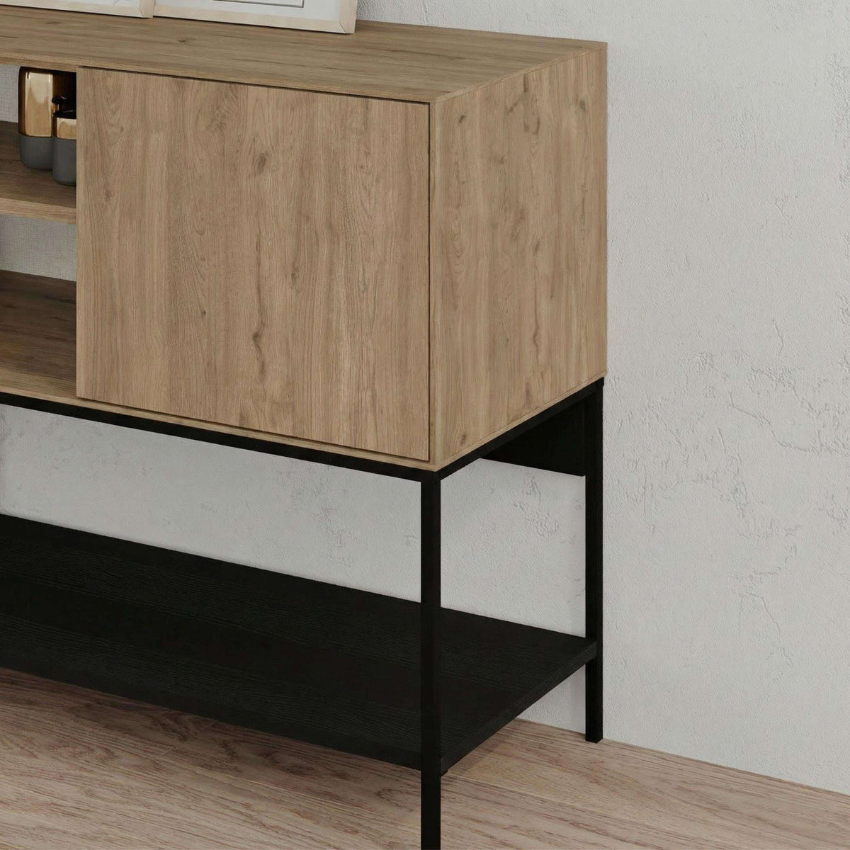 Warm wood console table cabinet with black metal base and open lower shelf.