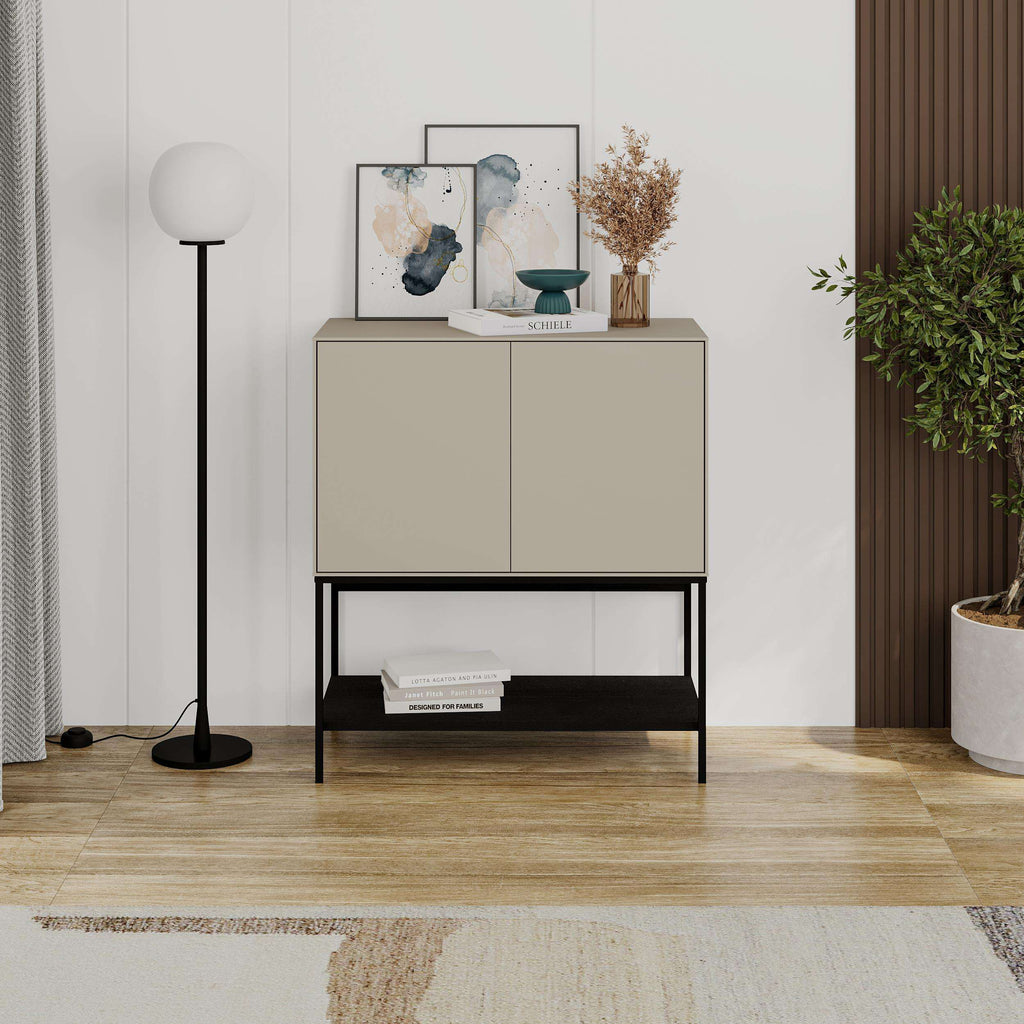 Modern console sideboard with two cabinet doors and open lower shelf, black frame, light color