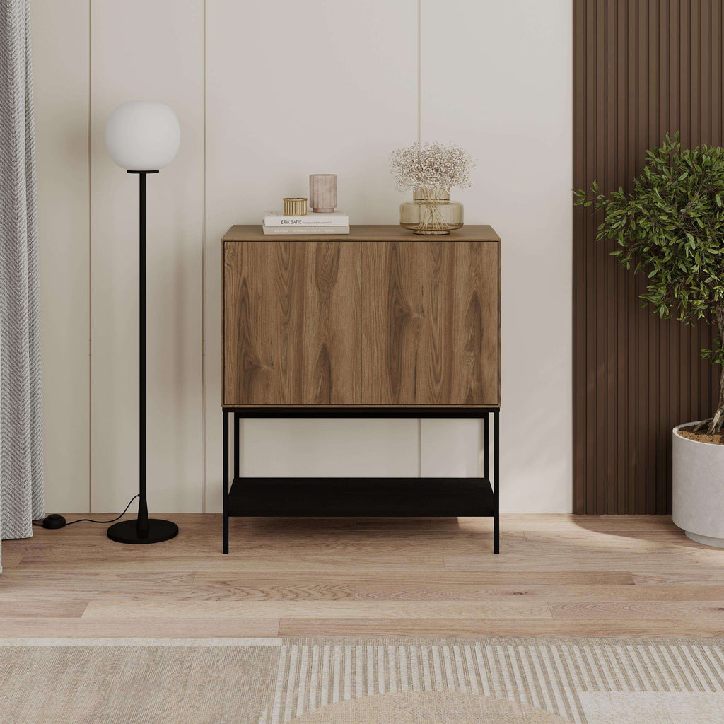 Wood console table with two cabinet doors, black frame, and open lower shelf