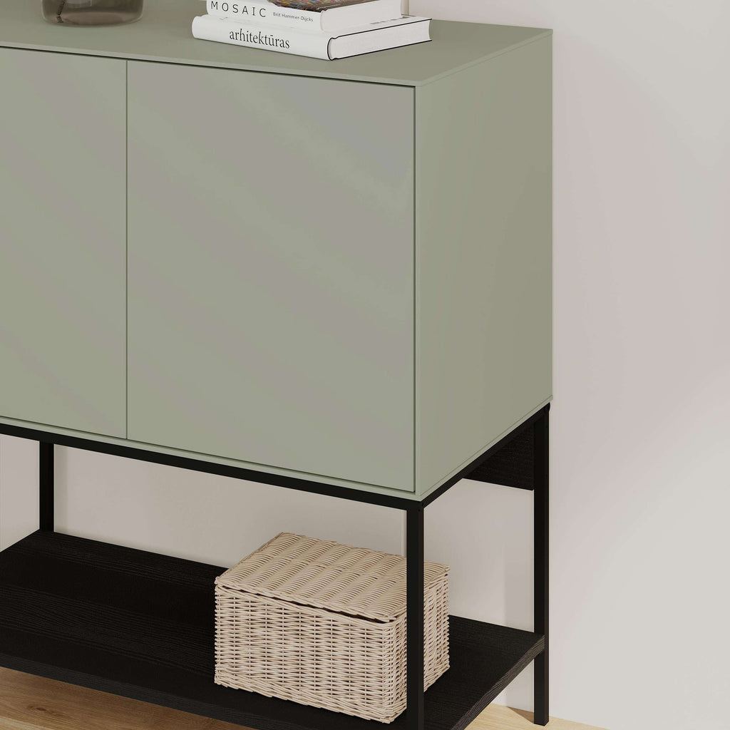 Ash green console table with two-door cabinet, open lower shelf, black frame legs.