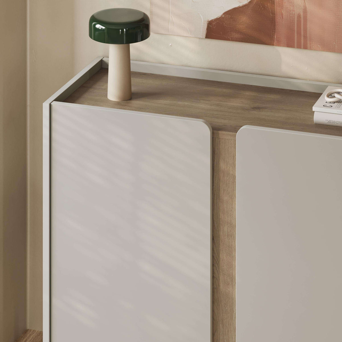 Light oak sideboard with two panel doors, open shelf, and slim metal legs
