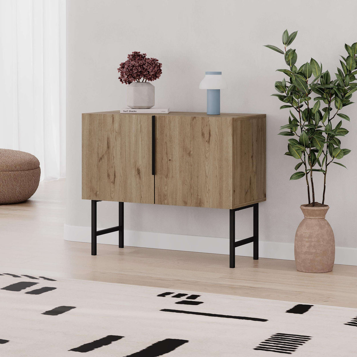 Natural oak 2-door console cabinet with black legs and vertical center handle.