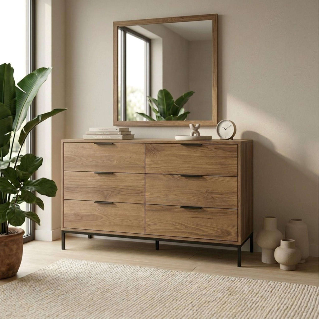 Whiskey oak 6-drawer wide chest with dark handles, black legs, and mirror