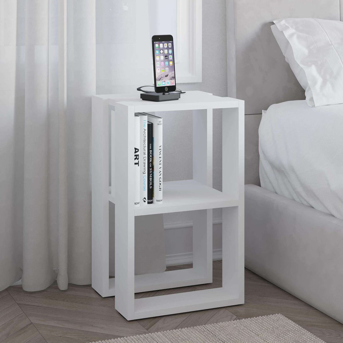 Modern bedside table with open shelves, white finish and phone stand on top