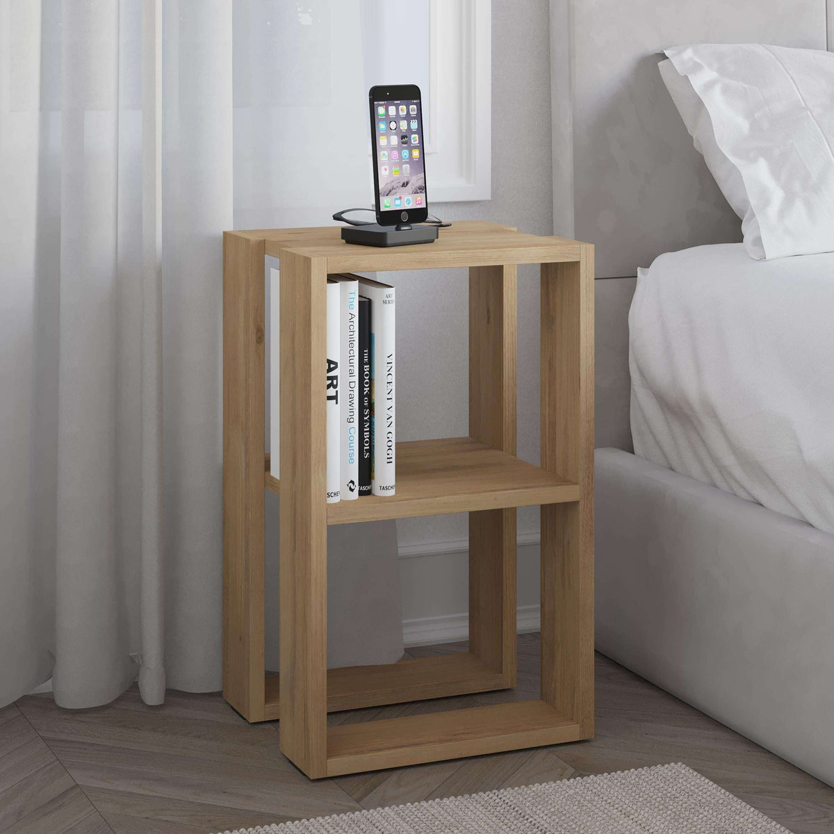 Oak modern bedside table with open cubby shelves and phone