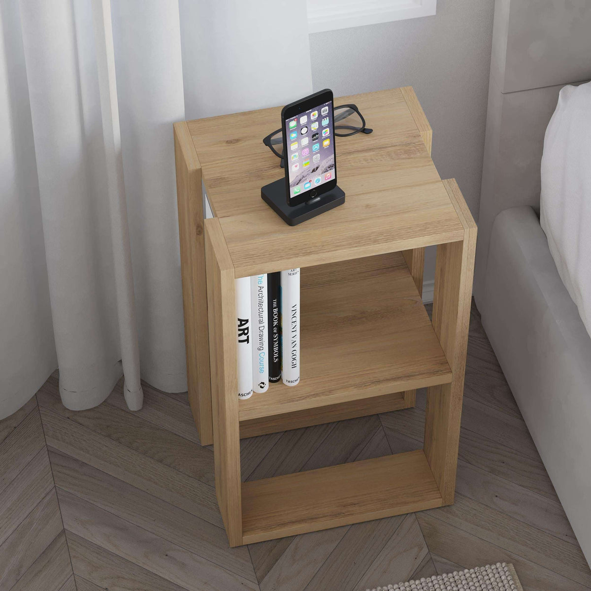 Oak bedside table with open shelves and a phone dock